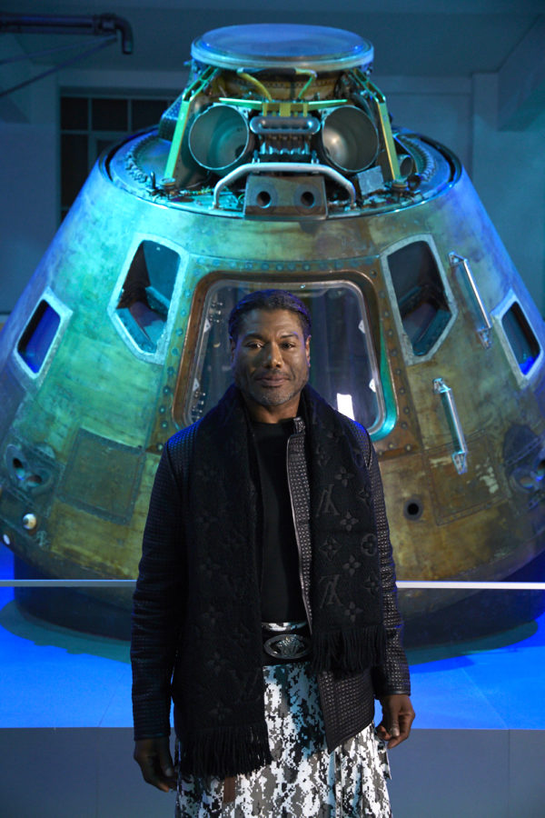 Christopher Judge standing beside the Apollo 10 capsule
